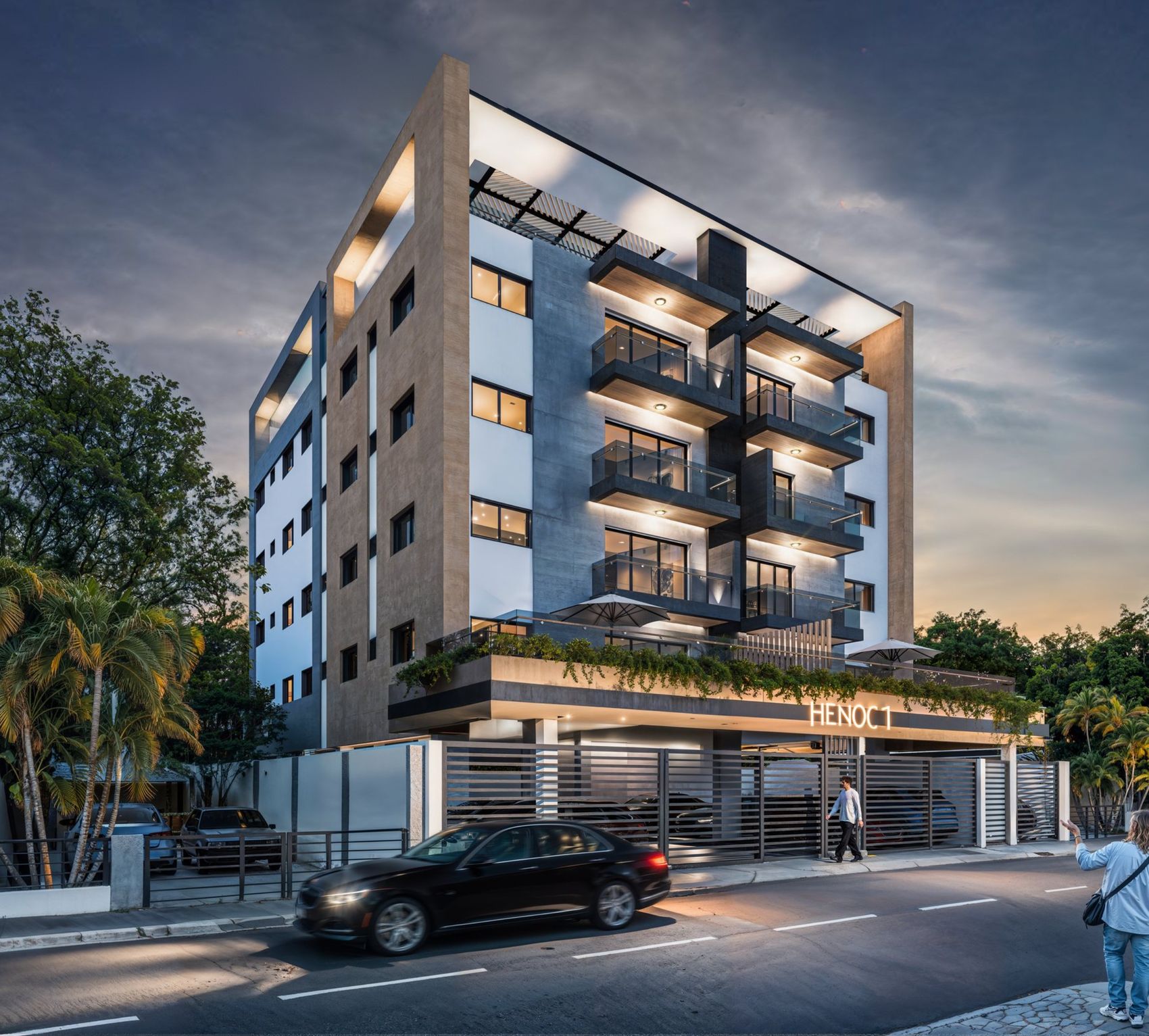 Render nocturno de la fachada de Residencial Henoc I, edificio de seis niveles con balcones y fachada iluminada